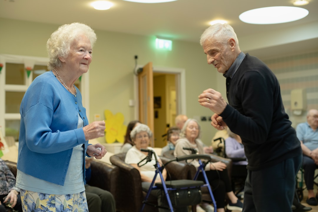 about-us-02 elderly-couple-dancing-with-others-watching-gqofinxkgvi