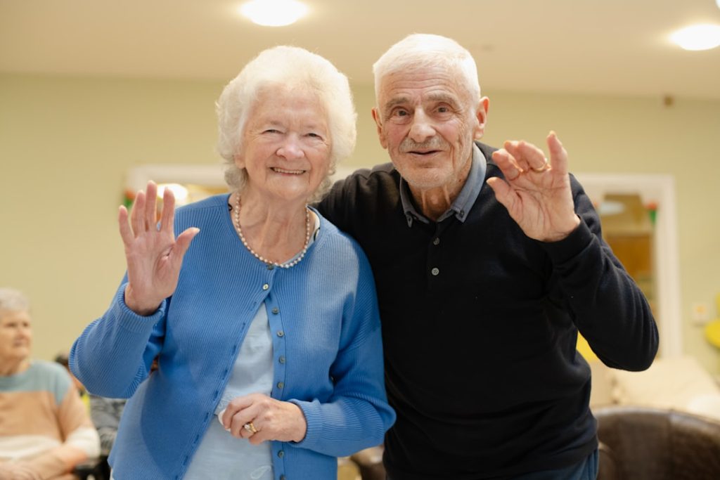 elderly-couple-waving-and-smiling-at-the-camera-1skhvkjv3gk elderly-couple-waving-and-smiling-at-the-camera-1skhvkjv3gk